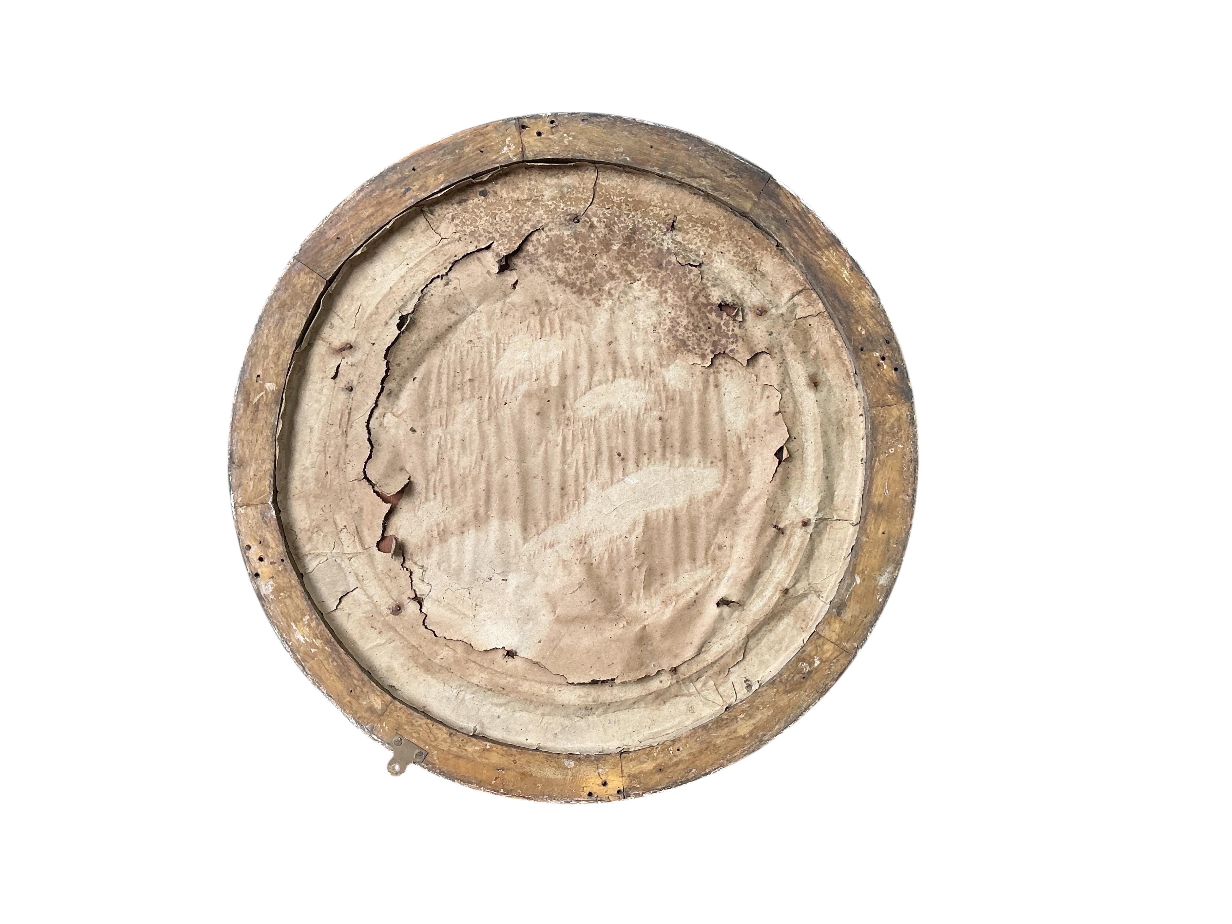 A Regency giltwood and composition circular convex wall mirror, in need of restoration, diameter 70cm